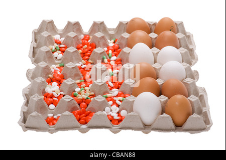object on white - egg and medical tablet on box Stock Photo
