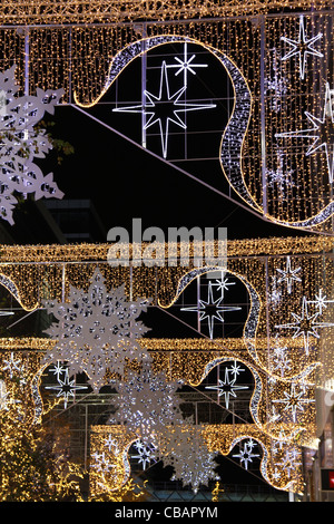 Outside Westfield Shopping Centre, Stratford, beautiful Christmas decorations of stars and snowflakes. Stock Photo