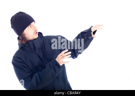 Frightened man in winter jacket, isolated on white background. Stock Photo