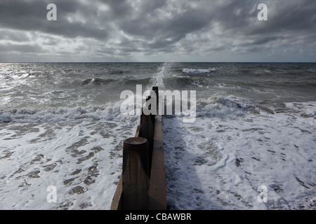 New groynes built as part of the sea defences on Tywyn beach Stock Photo