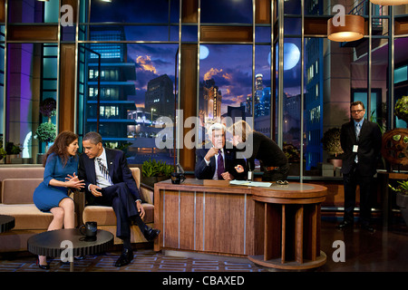 President Barack Obama talks with co-producer Michele Tasoff during a break in taping “The Tonight Show with Jay Leno” at NBC Studios October 25, 2011 in Burbank, CA. Stock Photo