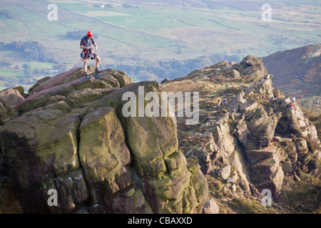 Rock Climber and Gritstone Edge, The Roaches, Peak District National Park near Leek, Staffordshire, UK Stock Photo