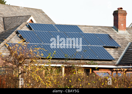 Solar panels on roof of bungalow in semi rural location Stock Photo