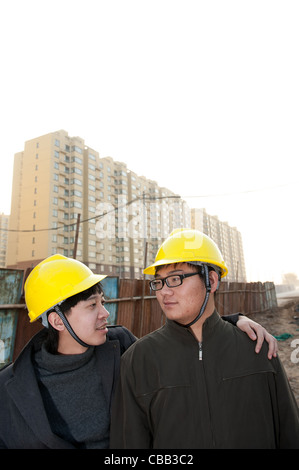 Construction workers chatting Stock Photo