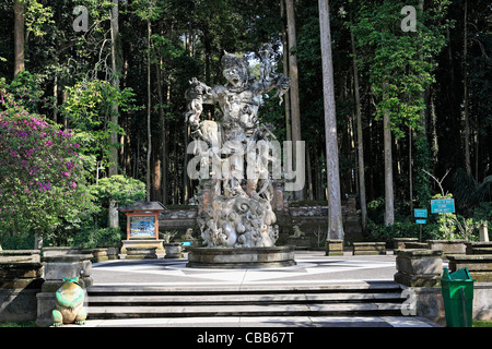Statue of Patung Kumbhakarna at the entrance to Bukit Sari Temple in the monkey forest at Sangeh. near Ubud, Bali, Indonesia Stock Photo