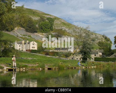 People fly fishing on the lake at Kilnsey Park and Trout Farm Wharfedale Yorkshire Dales North Yorkshire England UK United Kingdom GB Great Britain Stock Photo