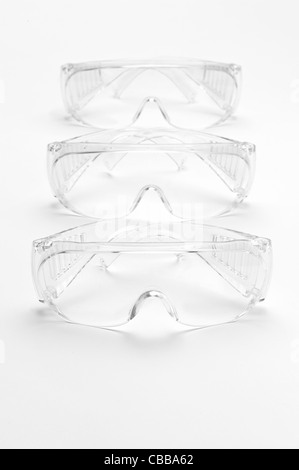 Three pairs of safety goggles Stock Photo