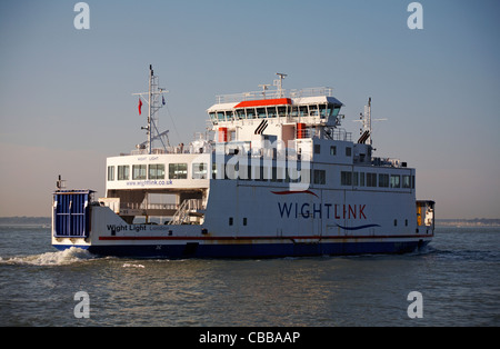 Wightlink ferry Wight Light leaving Yarmouth on the Isle of Wight across the Solent to the mainland Lymington, Hampshire UK in September - car ferry Stock Photo