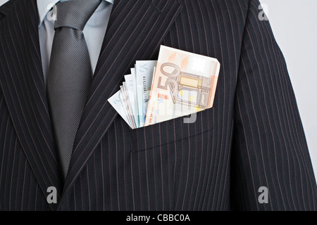 corruption, embracery, bribe, bribery, briber, banknotes, black money, euro, EUR, currency, crime, jacket, pocket, young man Stock Photo