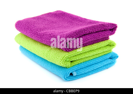 stacked colorful folded towels over white background Stock Photo