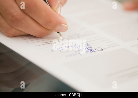 Close up of woman writing Stock Photo