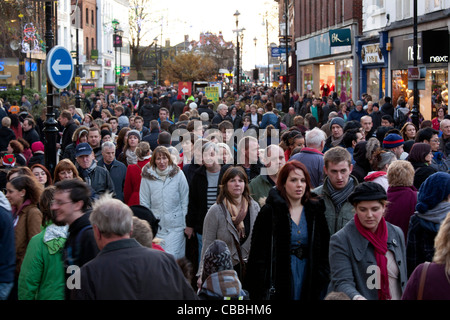 Shoppers pack the streets of Lincoln City Centre on a Saturday afternoon. Picture taken in the main High Street. Stock Photo