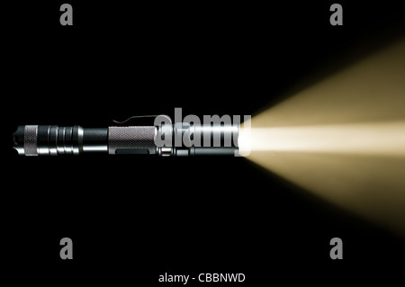 tactical police and military flashlight on black background with ...