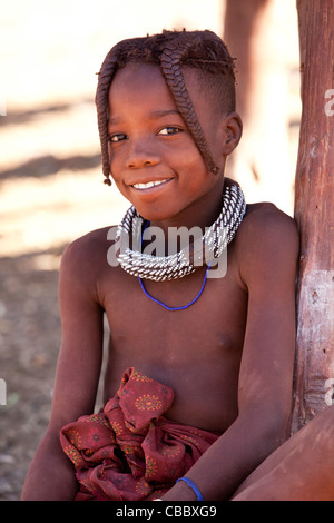 Africa, Namibia, Opuwo. Portrait of a young Himba girl. Credit as: Wendy Kaveney / Jaynes Gallery / DanitaDelimont.com Stock Photo