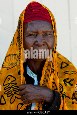 Mid Adult Woman Wearing Yellow Veil Portrait, Lamu, Kenya Stock Photo