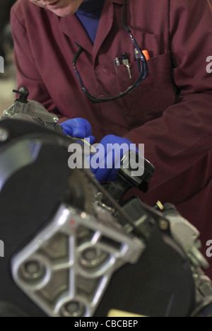 Student working on car engine Stock Photo
