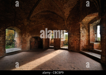 Room with hearth and stone window seat in recess inside medieval Beersel Castle, Belgium Stock Photo