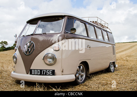 A lowered 1966 Split Screen VW Campervan, taken in a cornfield in Cornwall on a sunny day Stock Photo