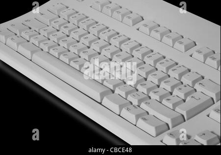 studio photography of a grey key pad in black reflective back Stock Photo