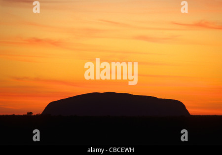 Ayers Rock silhouette on sunrise sky. Uluru Kata Tjuta National park, Northern Territory, Australia Stock Photo