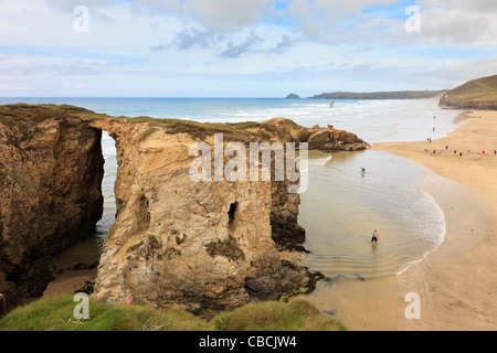 Natural rock arch at Droskyn Point with sandy Perran beach beyond. Perranporth, Cornwall, England, UK, Britain Stock Photo