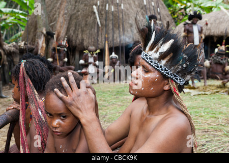 Dani Women lousing, Baliem Valley, West Papua, Indonesia Stock Photo