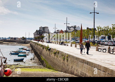 People walking by the harbour at Concarneau, Finistere, Brittany, France Stock Photo