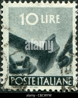 ITALY - CIRCA 1945: A stamp printed in Italy, is shown Breaking Chain, circa 1945 Stock Photo