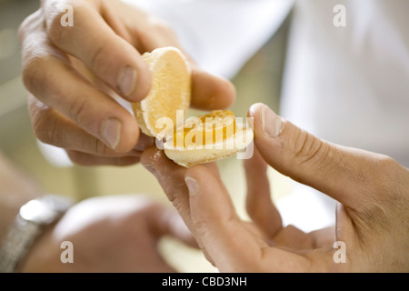 Chef assembling cookie Stock Photo