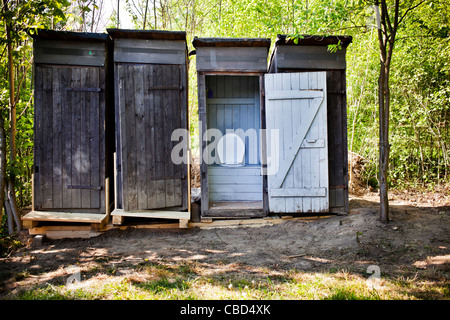 A row of primitive outdoor toilets without running water, latrine, WC. (CTK Photo/Rene Fluger) Stock Photo