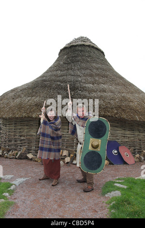 Celtic characters at the reconstruction of the Iron age dwelling at the Navan centre and fort near Armagh  in Northern Ireland. Stock Photo