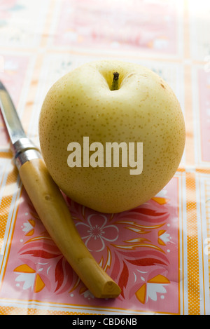 Nashi pear and paring knife Stock Photo