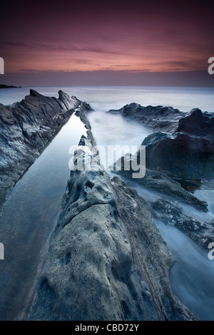 Still water on rocky beach Stock Photo