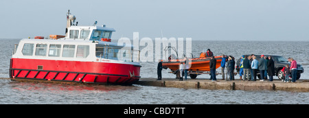 Passengers wait to board the ferry from Knott End to Fleetwood  across the Wyre Estuary, Lancashire Stock Photo