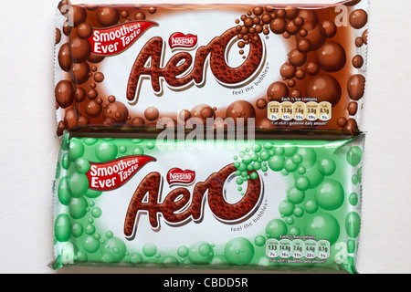 Two bars of Nestle Aero chocolate bars - one chocolate, one mint set against while background Stock Photo