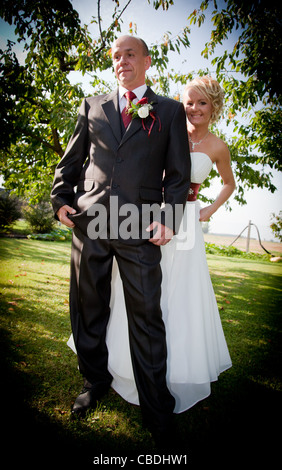 Happy bride and groom happy outdoors after wedding Stock Photo