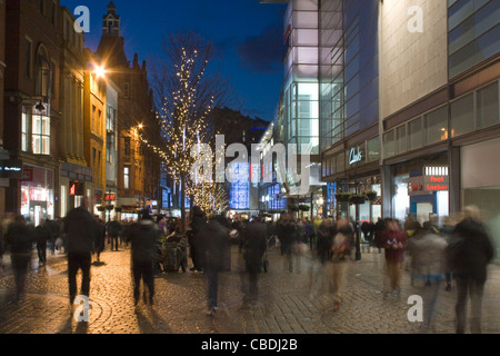 Christmas Shoppers Shopping buying presents  near The Arndale Centre on Market Street Manchester City Centre UK Stock Photo