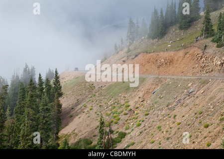 mountain driving in Colorado Rocky Mountains on highway 6 near continental divide and Loveland Pass - foggy day in summer Stock Photo