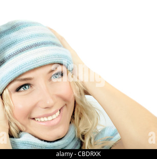 Cute girl wearing blue winter hat, beautiful young woman close up on smiling female face, happy teen in warm clothing, isolated Stock Photo