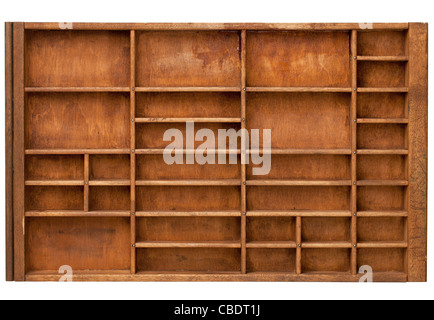 vintage wood printer (typesetter) drawer with numerous dividers, isolated on white Stock Photo