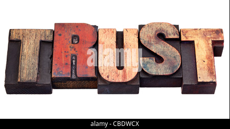 trust word in vintage grunge wooden letterpress printing blocks, isolated on white Stock Photo