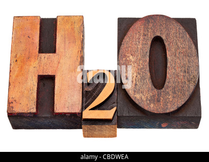 H2O - water chemical symbol in vintage wood letterpress printing blocks, stained by color inks, isolated on white Stock Photo