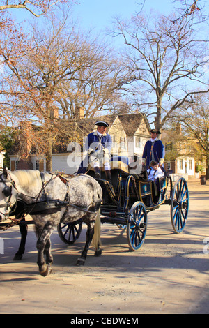 Tourists take carriage ride through the Historic Area in Colonial Williamsburg, Virginia, USA Stock Photo