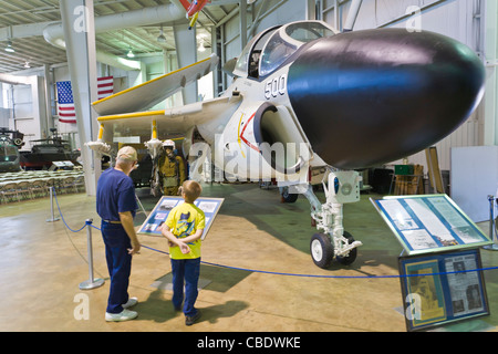 People looking at planes in the Aircraft museum at the USS Alabama Battleship Park in Mobile Alabama Stock Photo