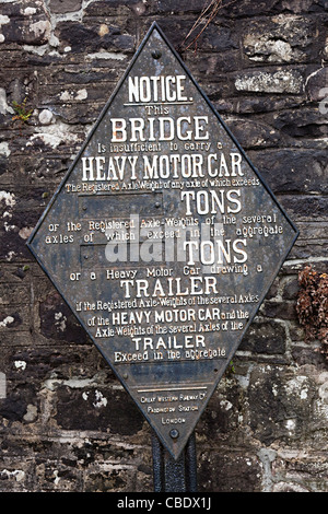 Old sign on bridge over Brecon and Abergavenny canal warning of weight limit Wales UK Stock Photo