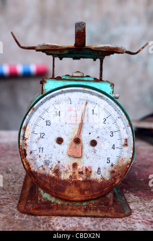 Rusty weighing scales at Kota Kinabalu waterfront market. Stock Photo