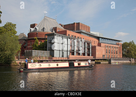 Canal boat cruises on the River Avon passes The Royal Shakespeare Theatre,  Stratford Upon Avon, Warwickshire, England, UK. Stock Photo