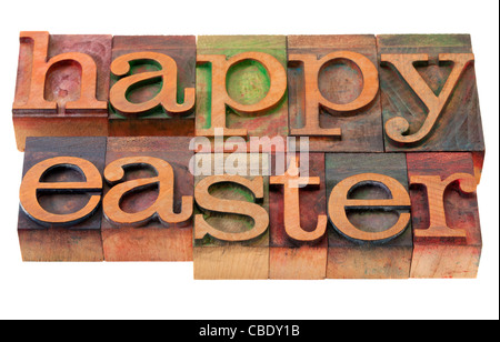 happy easter- words in vintage wooden letterpress printing blocks, stained by color inks, isolated on white Stock Photo