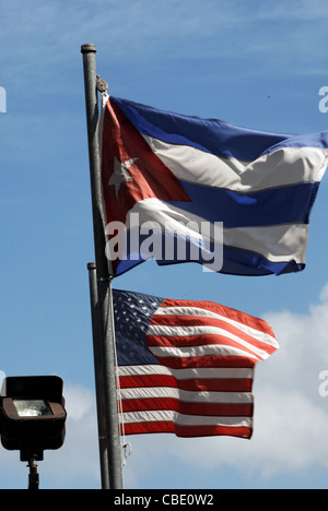 US and Cuban flags fly at the Bay of Pigs memorial in Miami Stock Photo