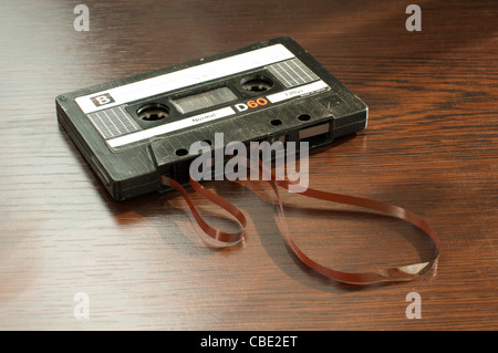 Audio tape cassette with subtracted out tape. Old broken cassette Stock Photo